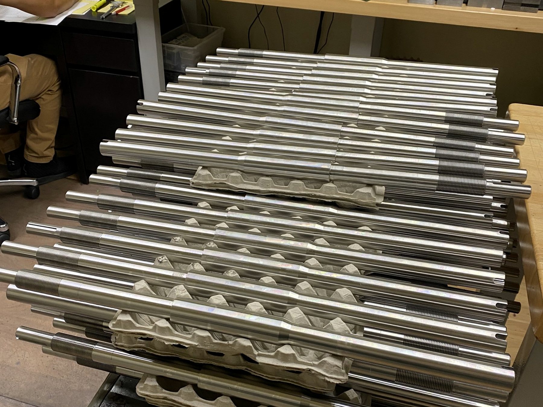 RJ's inspection bench with gaging instruments and machined parts