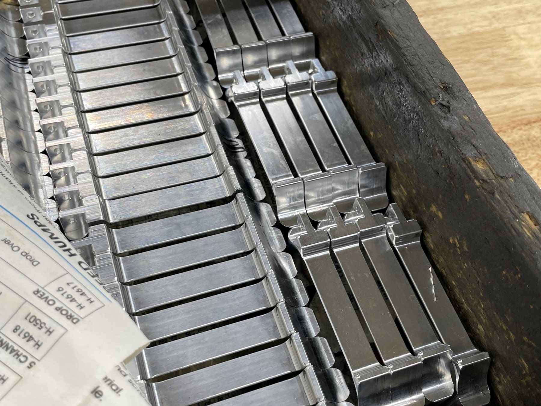 Turned bar components staged for secondary operations